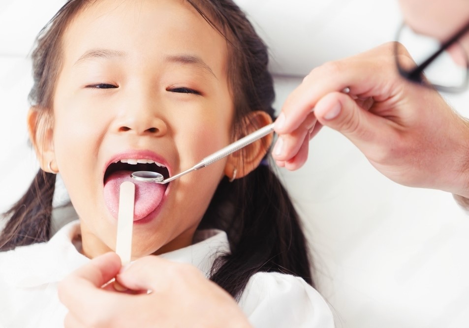 The risks and benefits of treating cavities in baby teeth